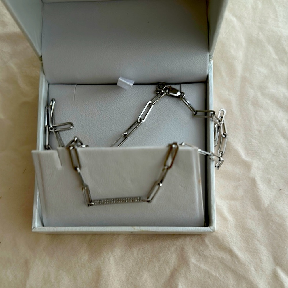 Gorgeous never worn. Paper clip links with a row of very small diamonds
